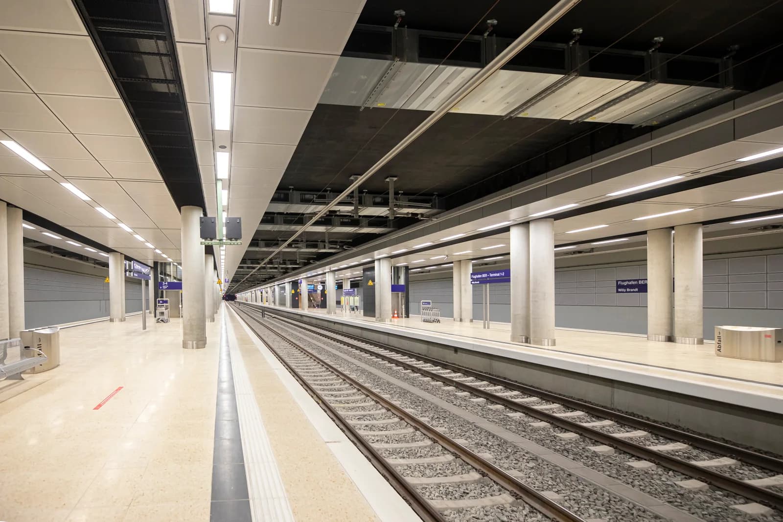 Train station at Berlin Brandenburg Airport; a ground-transfer example, not a route or fare quote for another airport.