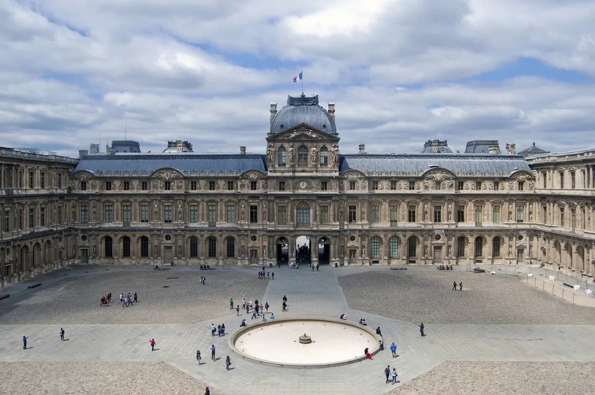West wing of the Louvre’s Cour Carrée courtyard, with the circular fountain in the centre.