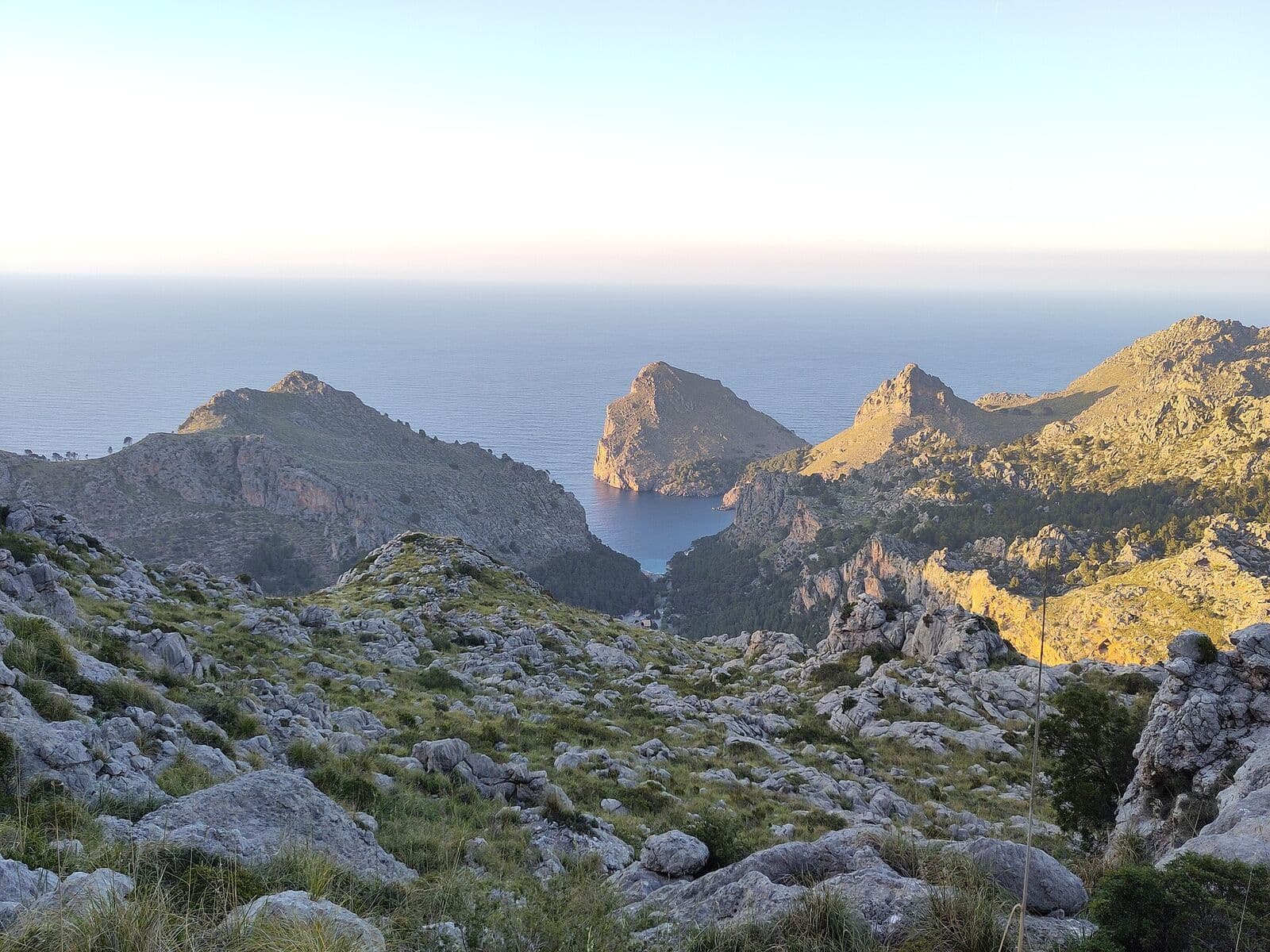 Sa Calobra and the limestone mountains of the Serra de Tramuntana by the sea at sunset